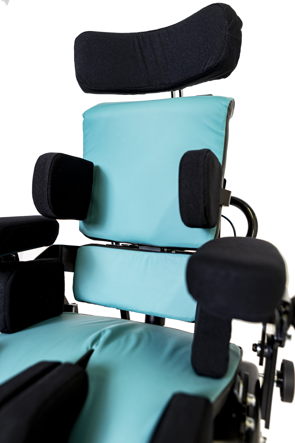 Detalj av ODE sittesystem med ryggstøtte, laterale støtter og komfortputer for individuell tilpasning.